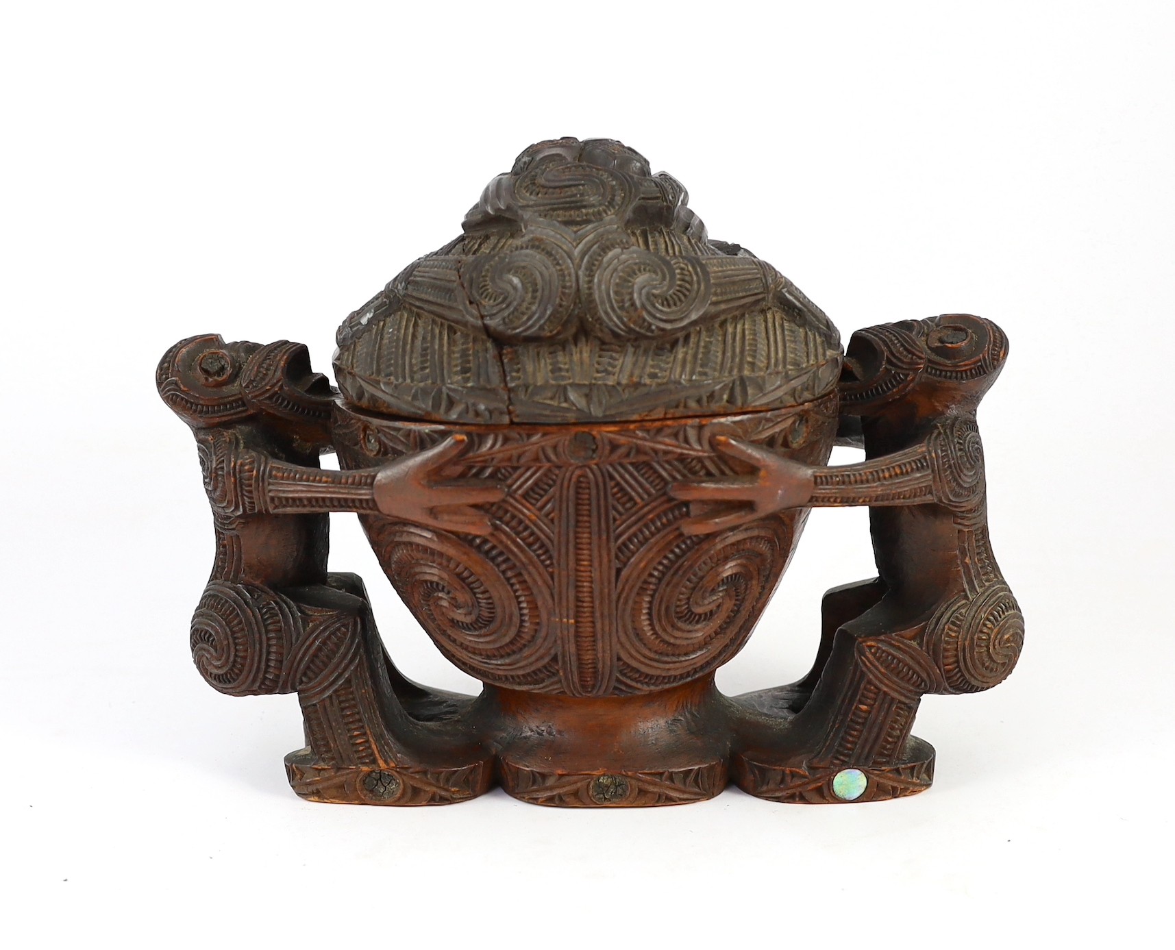 A Maori carved wood oblong bowl and cover, kumete, c.1880-1910, height 23cm length 31cm